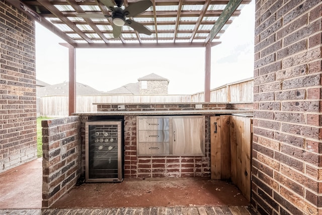 view of patio featuring a pergola, ceiling fan, and wine cooler