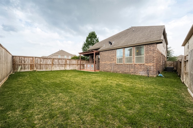 view of yard featuring central AC and a patio area