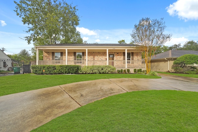 view of front of house with covered porch and a front yard