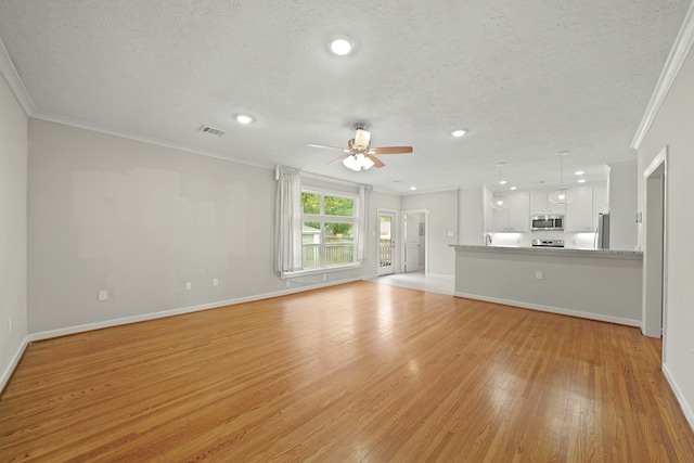 unfurnished living room with light hardwood / wood-style flooring, ornamental molding, a textured ceiling, and ceiling fan