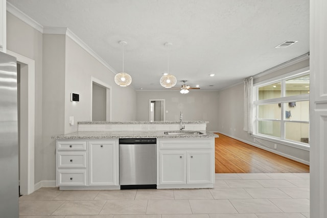 kitchen featuring light hardwood / wood-style floors, white cabinets, stainless steel appliances, and sink