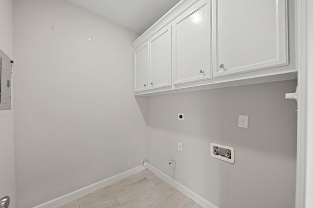 laundry room with cabinets, hookup for an electric dryer, light tile patterned flooring, and washer hookup