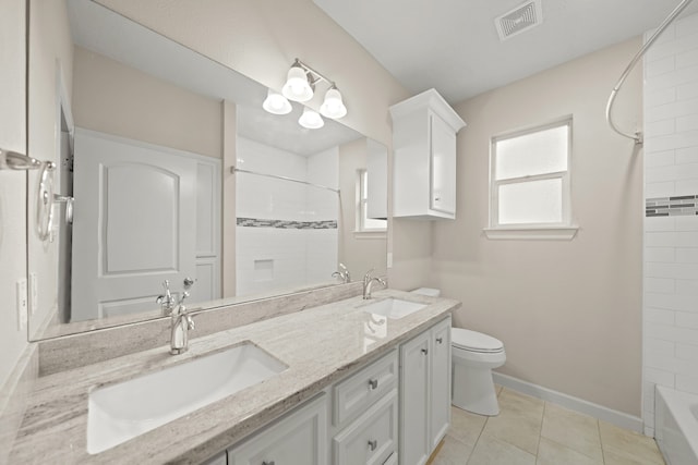 bathroom featuring vanity, toilet, and tile patterned floors