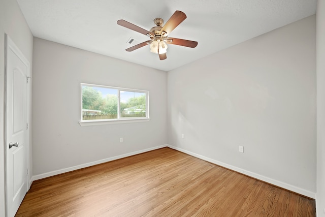 empty room featuring light hardwood / wood-style flooring and ceiling fan