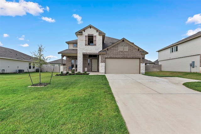 view of front of home with a front lawn and a garage