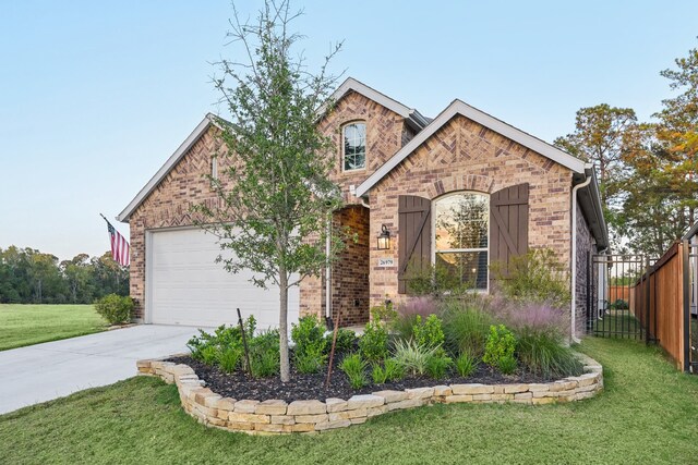 view of front of house featuring a garage and a front yard