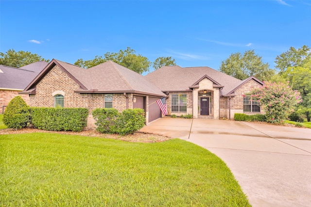 view of front facade featuring a front lawn and a garage