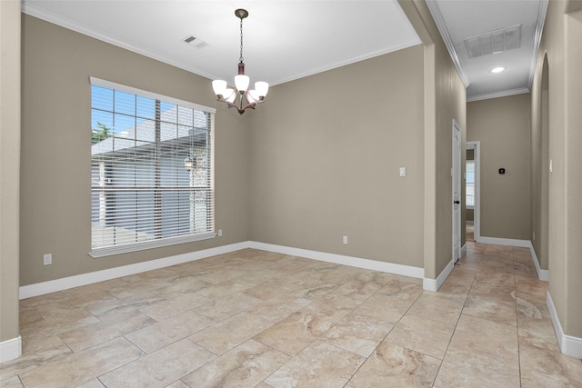 spare room featuring crown molding and a chandelier