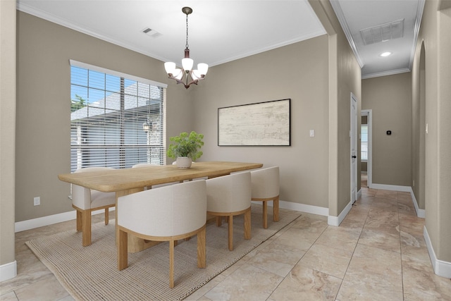 dining space with crown molding and an inviting chandelier