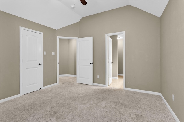 unfurnished bedroom featuring light carpet, ceiling fan, and lofted ceiling