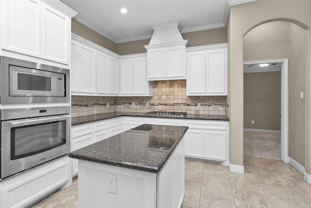 kitchen featuring white cabinetry, a kitchen island, and appliances with stainless steel finishes