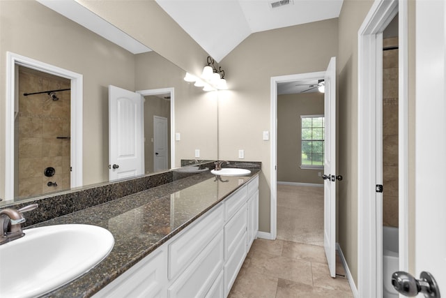 bathroom featuring tile patterned floors, ceiling fan, vanity, and vaulted ceiling