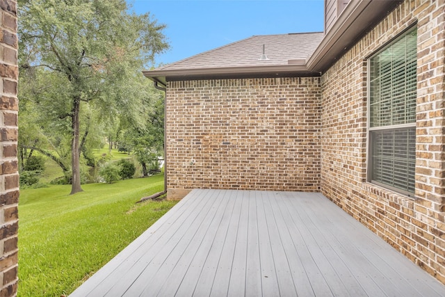 deck featuring a lawn