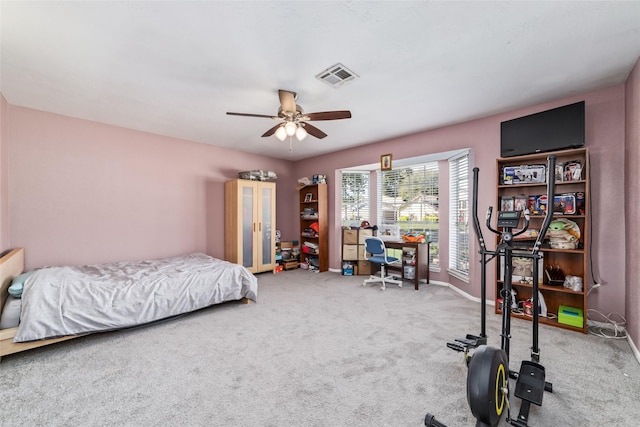 bedroom with ceiling fan and carpet floors