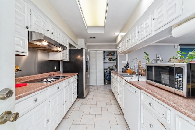 kitchen featuring sink, white cabinets, ornamental molding, and appliances with stainless steel finishes