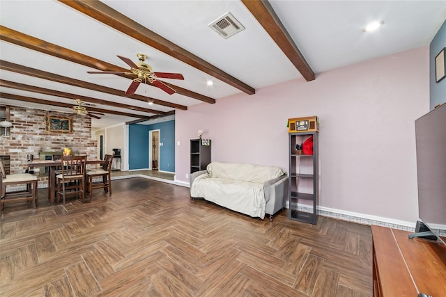 living room featuring beamed ceiling, ceiling fan, brick wall, and dark parquet floors