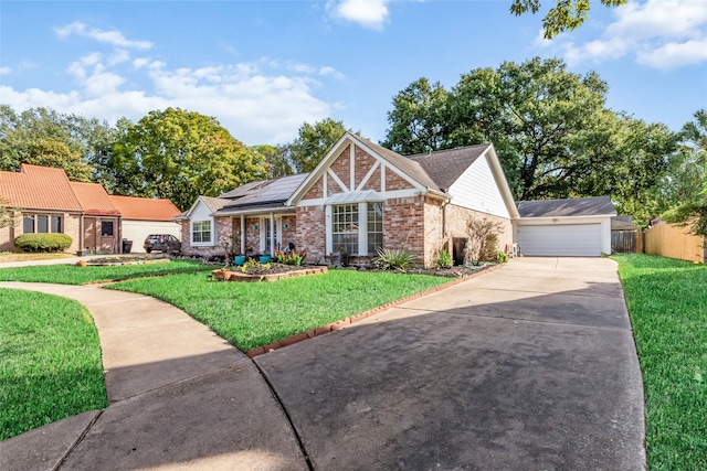 view of front of home featuring solar panels, a garage, and a front lawn