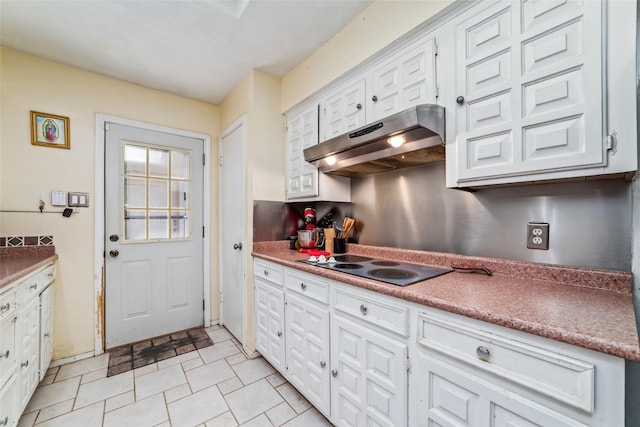 kitchen with white cabinetry and black electric cooktop