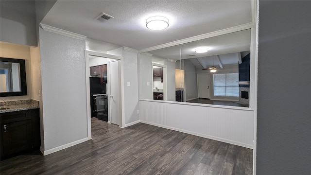 kitchen featuring ornamental molding, a textured ceiling, pendant lighting, and dark hardwood / wood-style floors