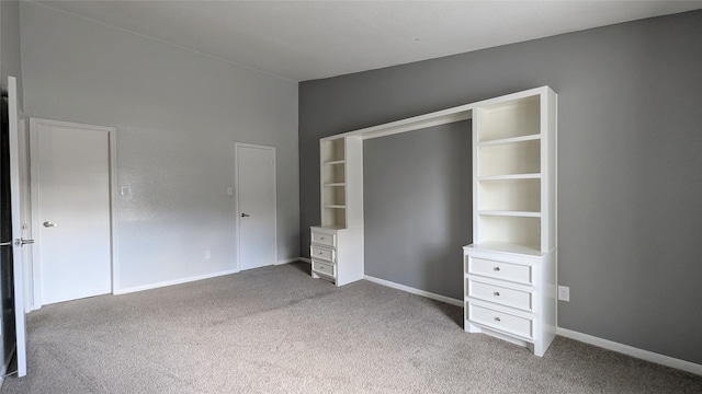 unfurnished bedroom featuring light colored carpet