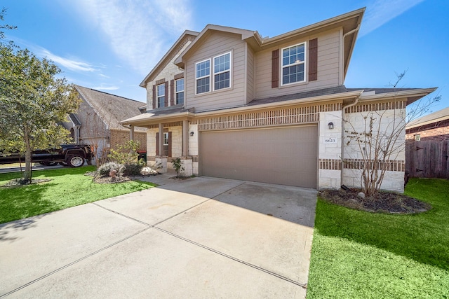 view of front of house featuring a front lawn and a garage