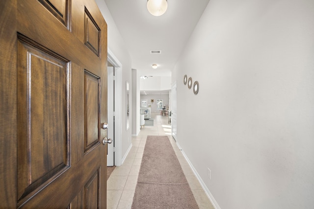 hallway with light tile patterned flooring