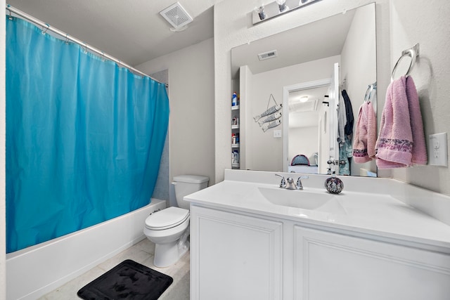 full bathroom with toilet, shower / bath combo with shower curtain, vanity, and tile patterned flooring