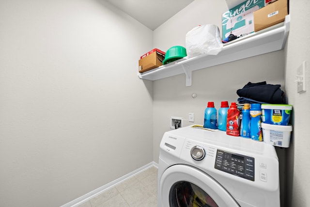 clothes washing area featuring washer / dryer