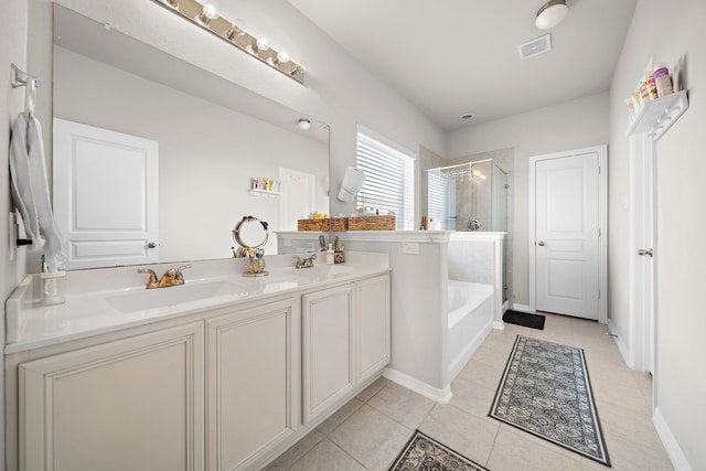 bathroom with vanity, plus walk in shower, and tile patterned flooring