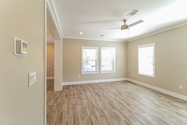 unfurnished room with ceiling fan, ornamental molding, and light hardwood / wood-style flooring