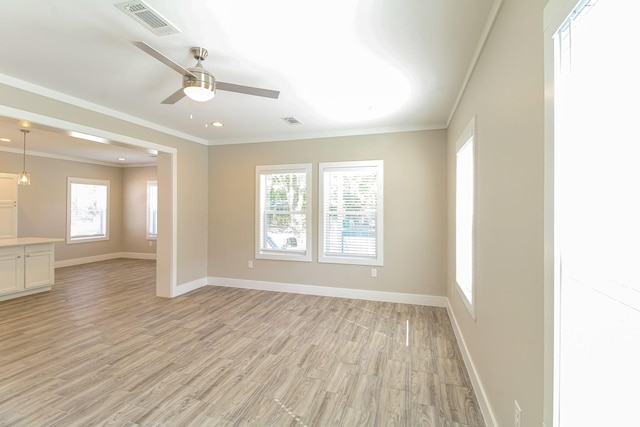 6605 Greenhurst St, Houston, TX 77091 - unfurnished room with crown molding, ceiling fan, light wood finished floors, baseboards, and recessed lighting