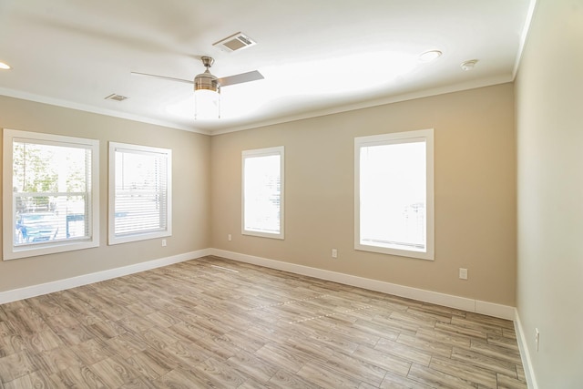 6605 Greenhurst St, Houston, TX 77091 - empty room with ornamental molding, ceiling fan, light wood-style flooring, a smoke detector, and baseboards