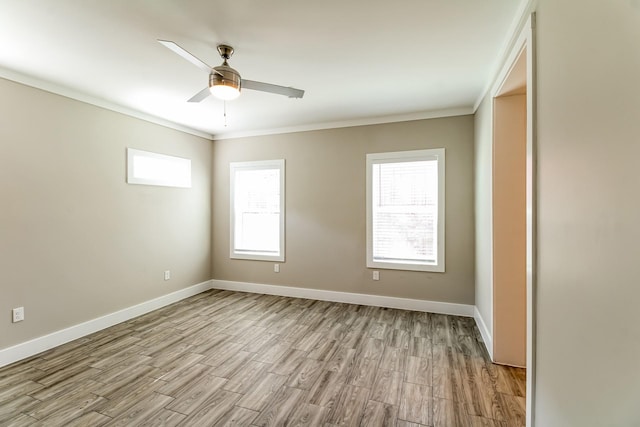 6605 Greenhurst St, Houston, TX 77091 - unfurnished room with ornamental molding, light wood-style flooring, ceiling fan, and baseboards