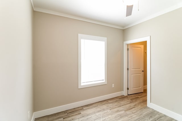 unfurnished room featuring ornamental molding, light hardwood / wood-style floors, and ceiling fan