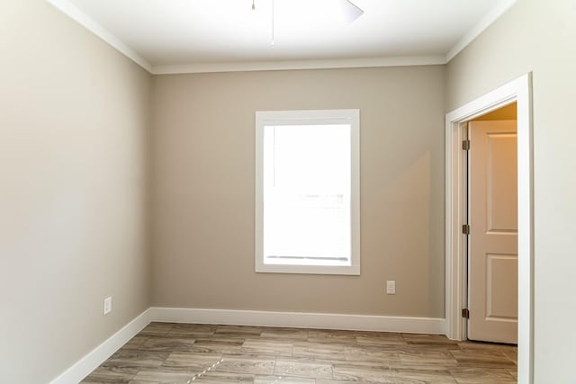 6605 Greenhurst St, Houston, TX 77091 - unfurnished room featuring ornamental molding, baseboards, and light wood-type flooring