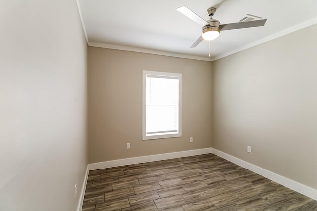 6605 Greenhurst St, Houston, TX 77091 - spare room featuring ornamental molding, wood finished floors, ceiling fan, and baseboards