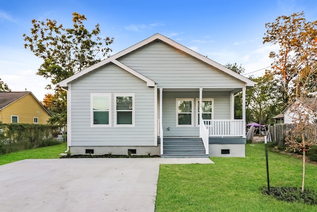 view of front of property with a porch and a front lawn