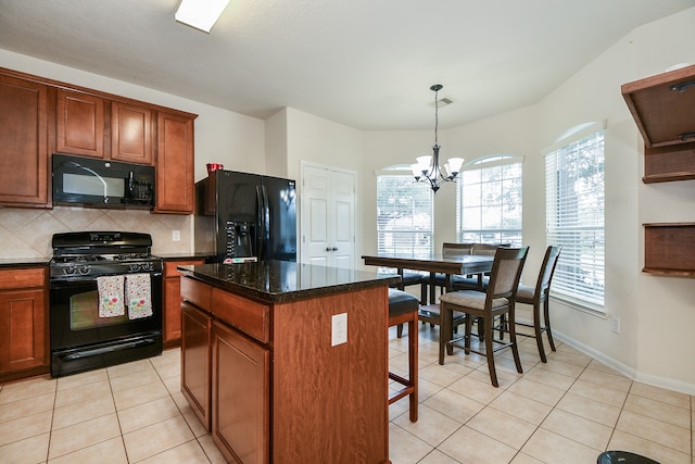 kitchen with black appliances, a center island, a notable chandelier, decorative backsplash, and light tile patterned floors