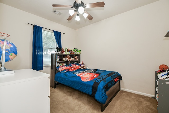 carpeted bedroom featuring ceiling fan