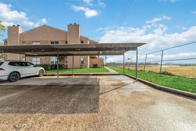 view of parking featuring a carport