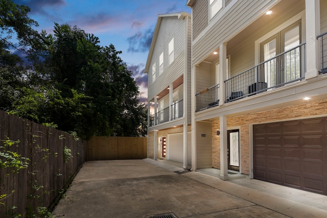 exterior space with a balcony and a garage