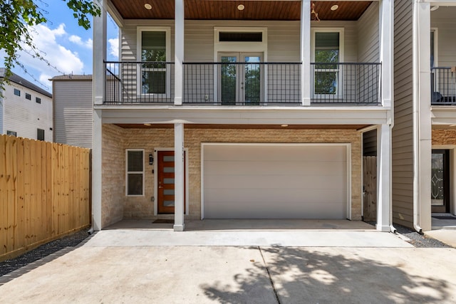 view of front of home with covered porch and a garage