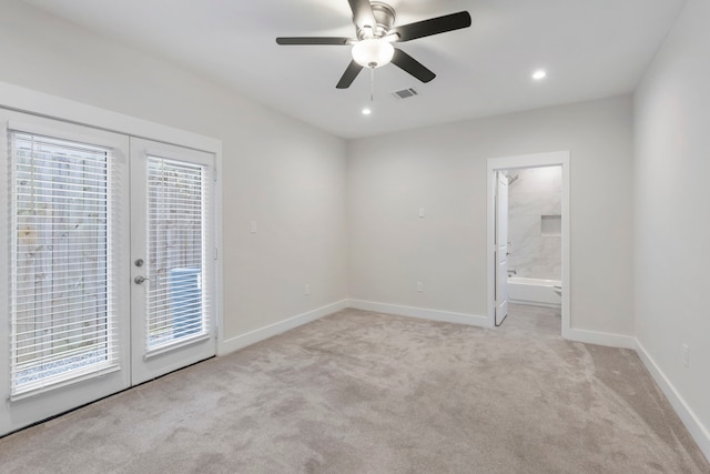 unfurnished bedroom featuring ceiling fan, access to exterior, connected bathroom, french doors, and light colored carpet