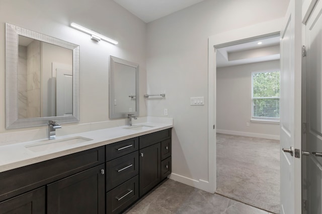 bathroom with vanity and tile patterned flooring