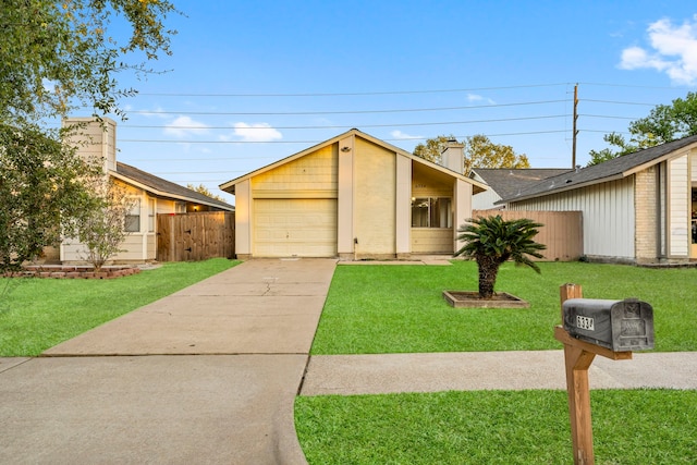 ranch-style home featuring a front yard and a garage