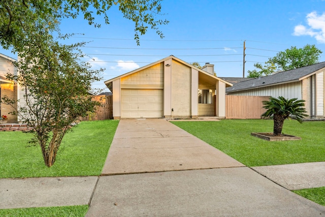 single story home featuring a front lawn and a garage