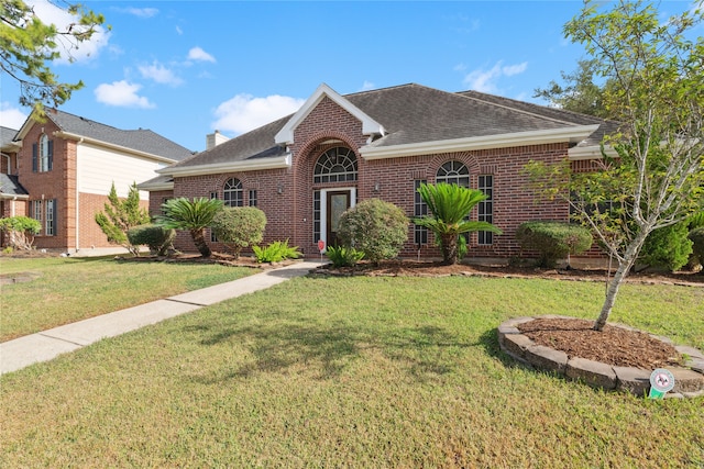 view of front of home with a front yard