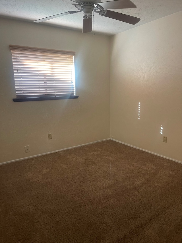 unfurnished room featuring a textured ceiling, carpet flooring, and ceiling fan