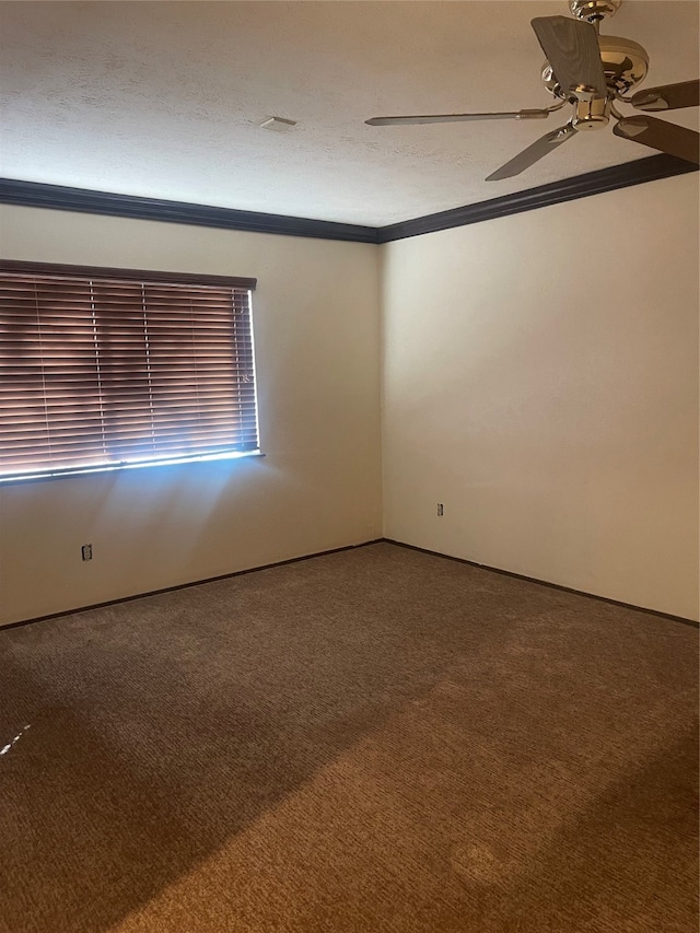 carpeted spare room featuring crown molding, a textured ceiling, and ceiling fan