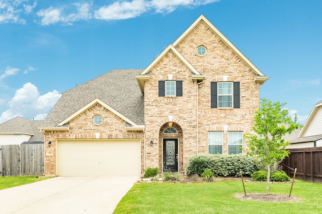 view of front property with a front lawn and a garage